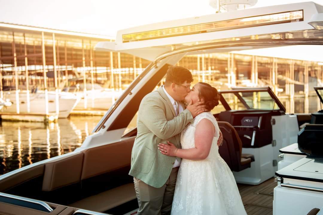 people on boat kissing