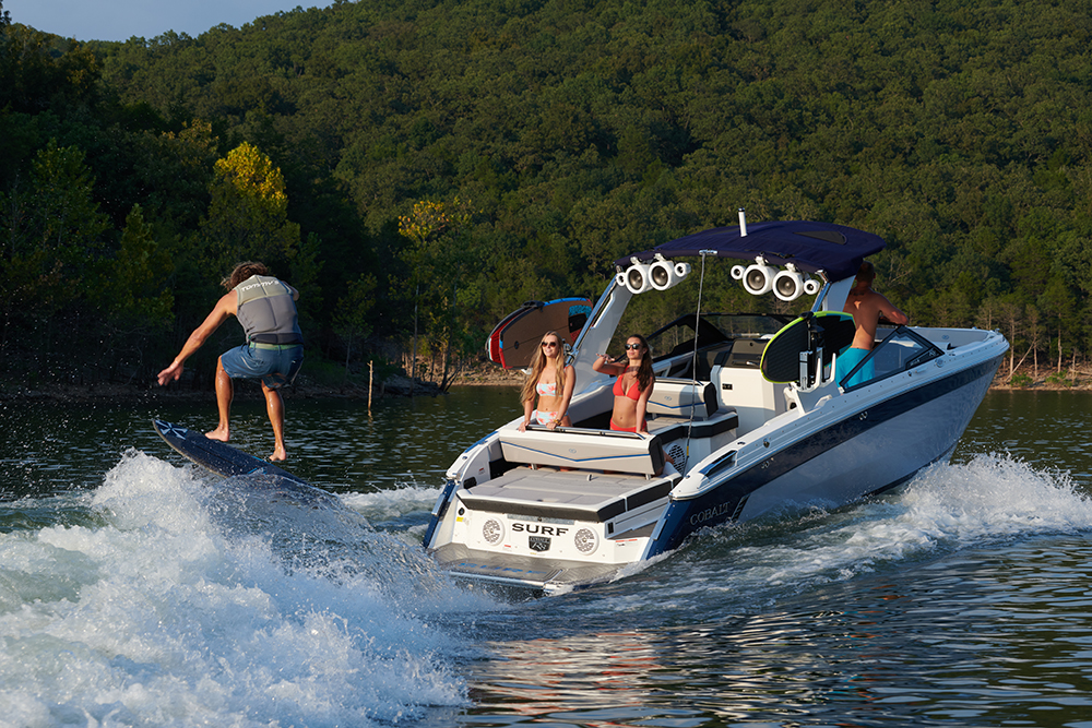 person wakeboarding behind boat