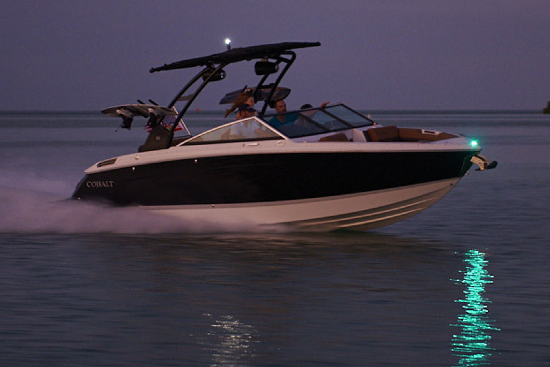 boat on water during night time