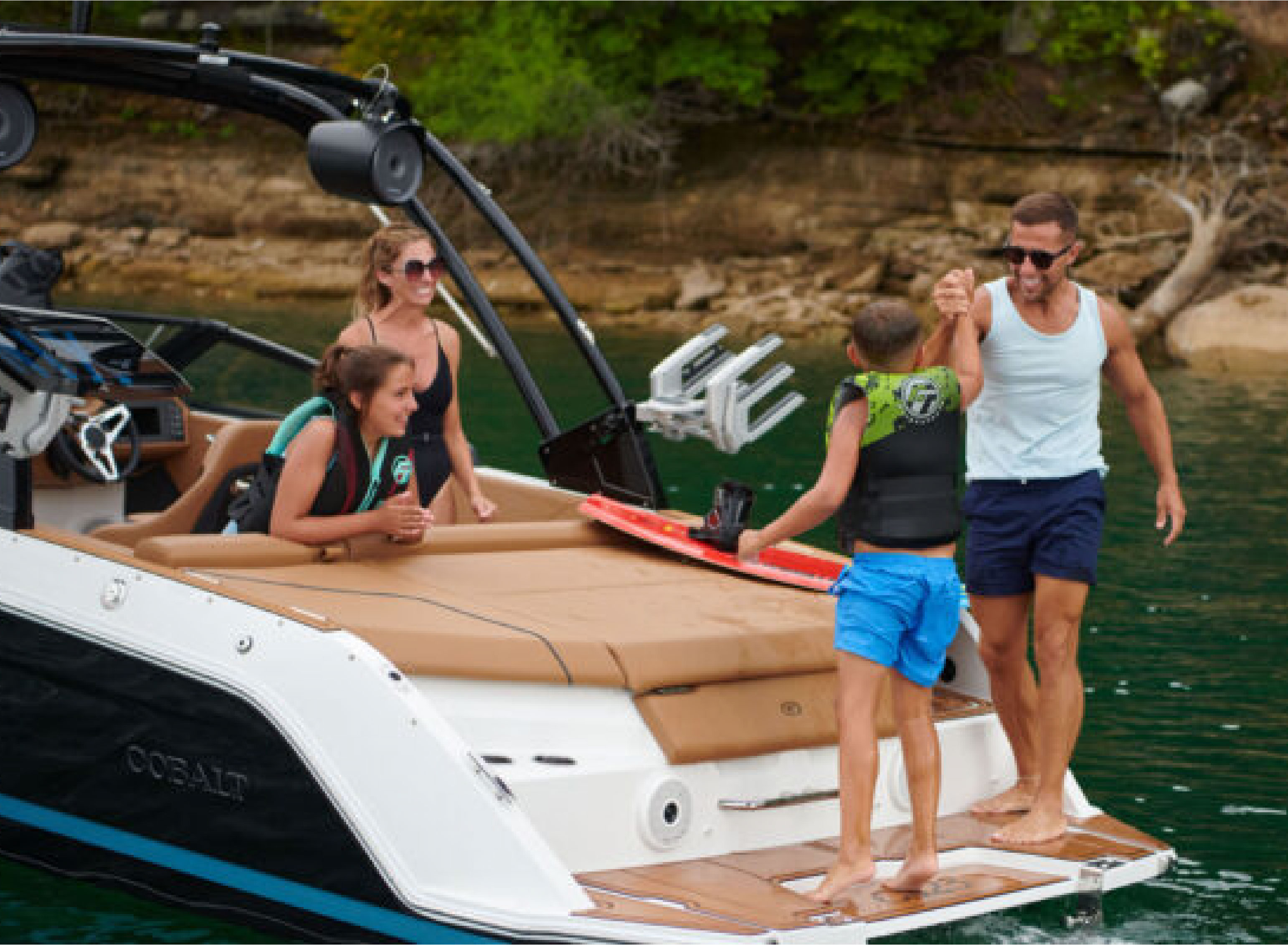 people on a boats swim platform