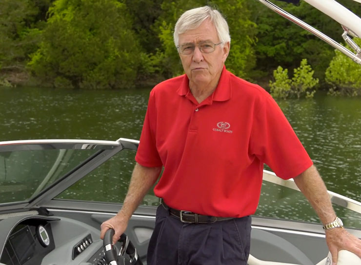 man in red shirt on boat