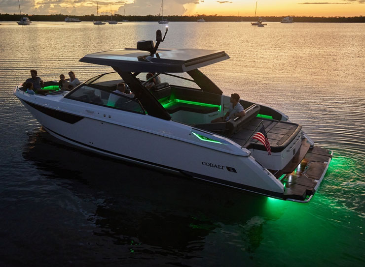 boat out at night with green lights