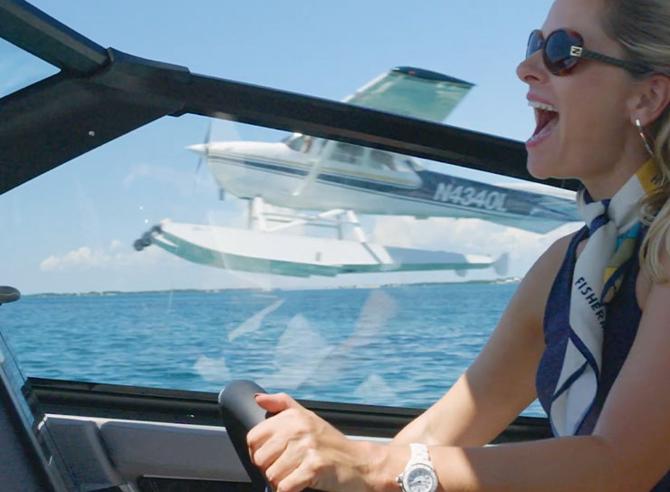 woman driving boat