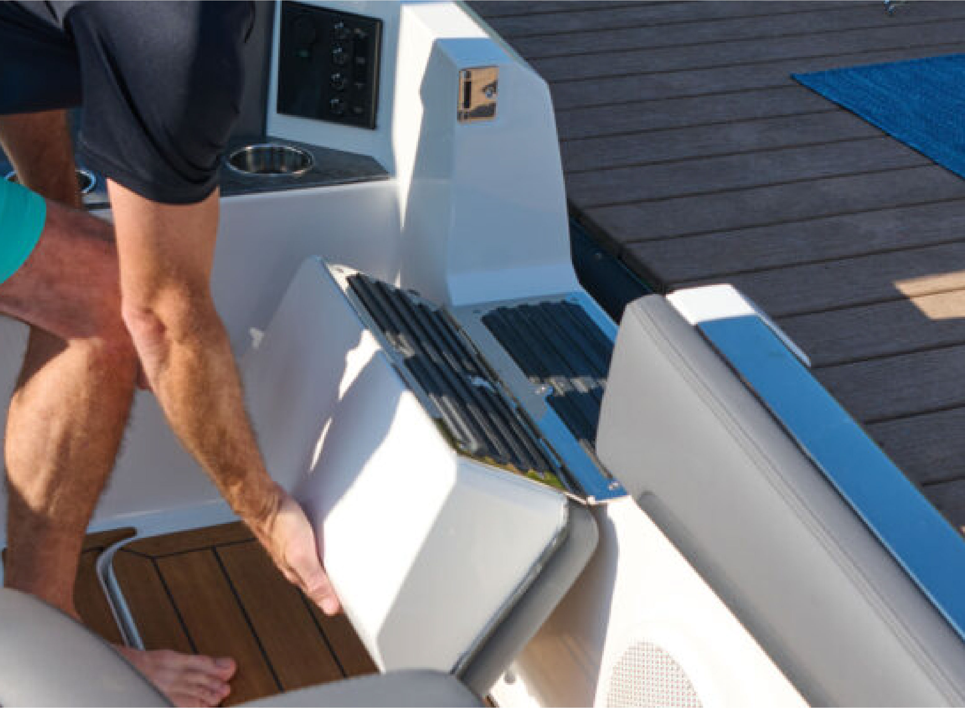 person flipping up the side step on a boat
