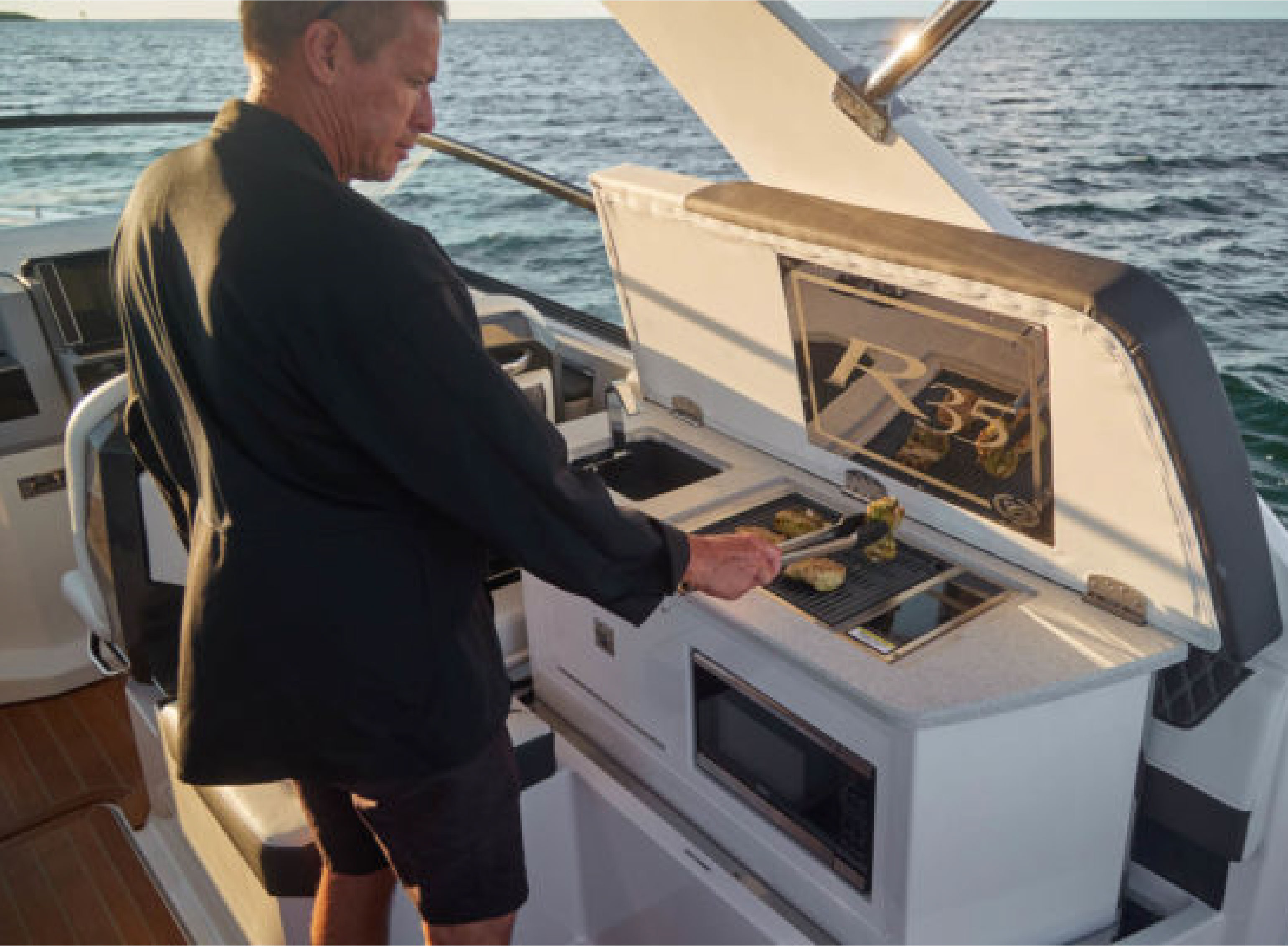 a mean grilling food on a boat