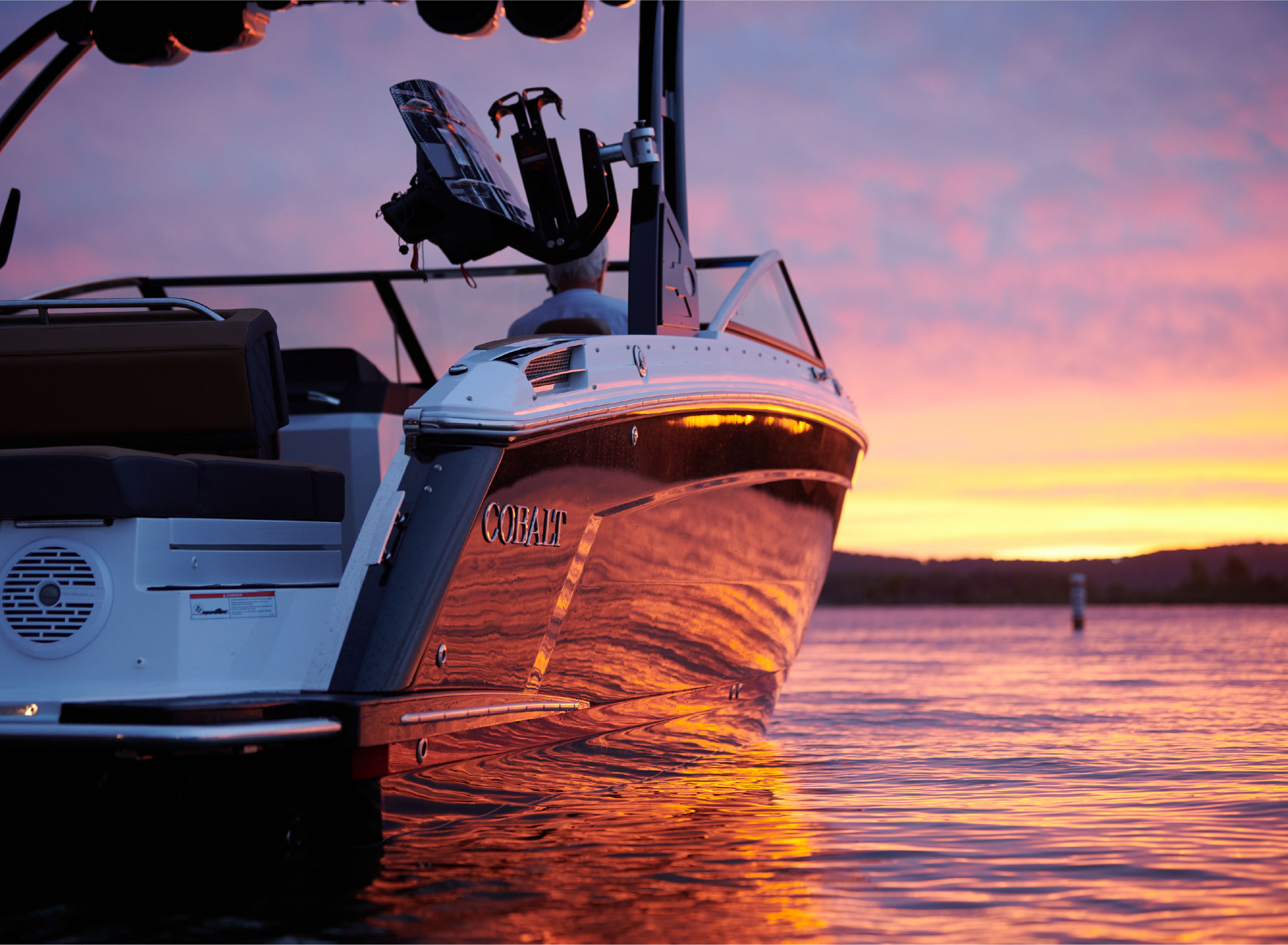 boat facing towards the distance during a sunset 