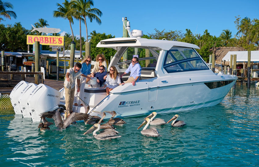 people on boat near dock