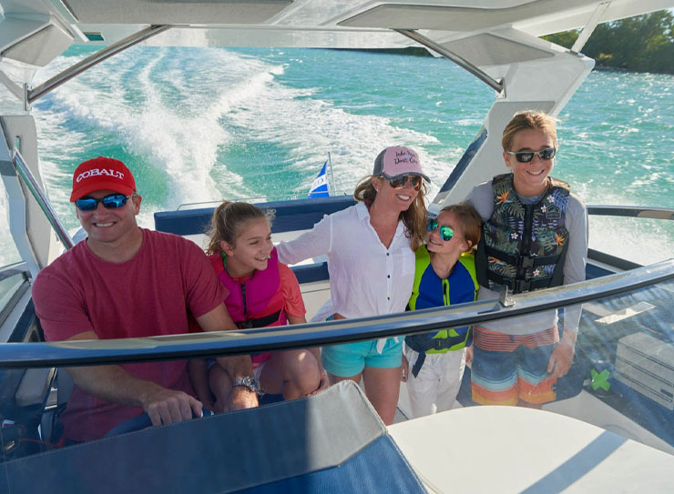man with family on boat