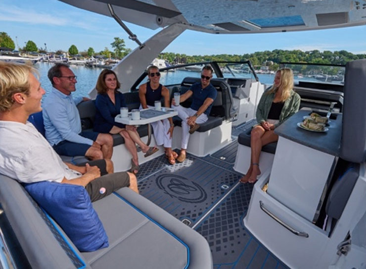 people relaxing on boat about to eat