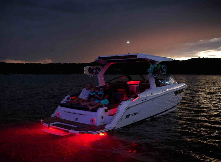 boat with red lights at night