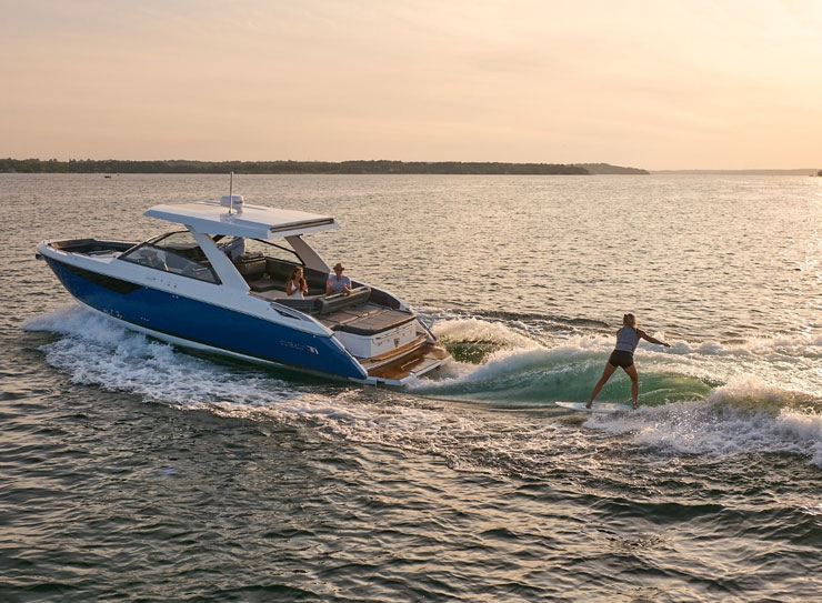 woman surfing behind boat