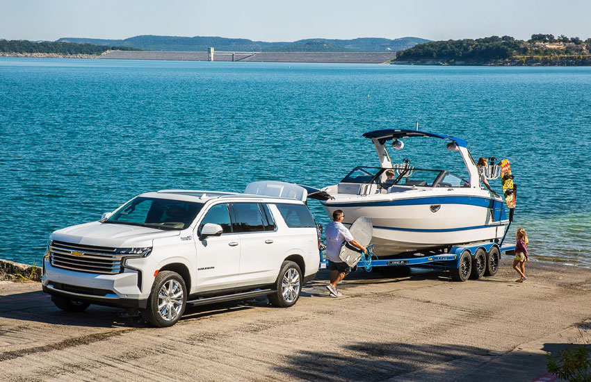 family getting a boat into the water