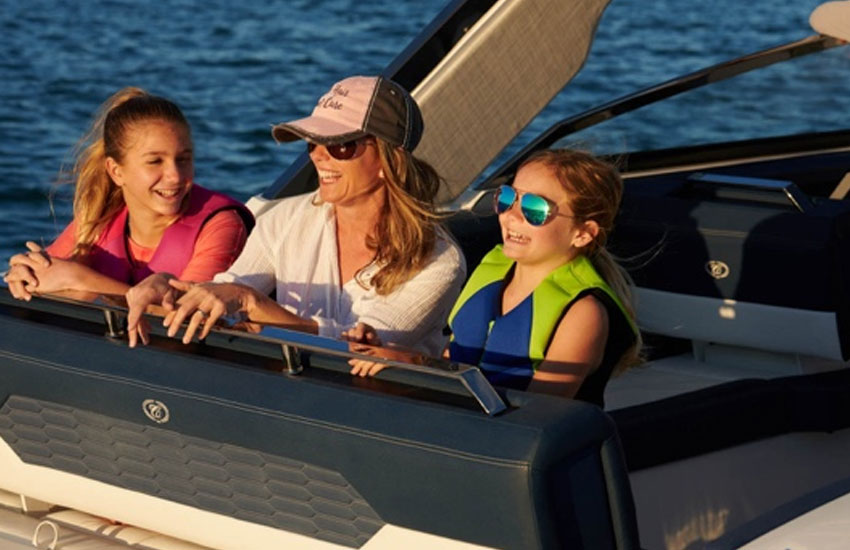family on back of boat