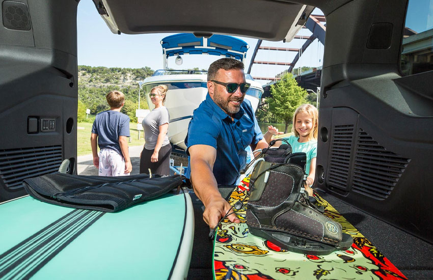 man taking wake board out