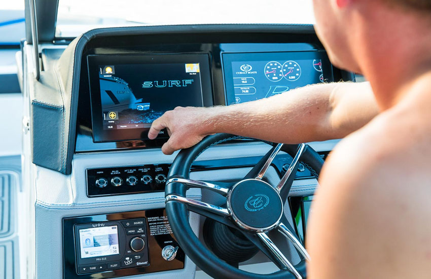 man looking at boat dash
