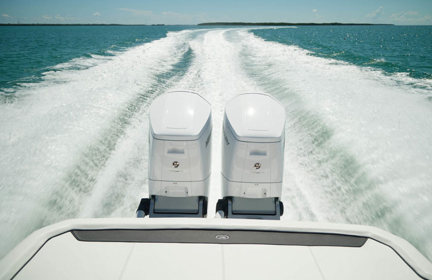 Twin Mercury Marine outboards on a Cobalt running at high speed.