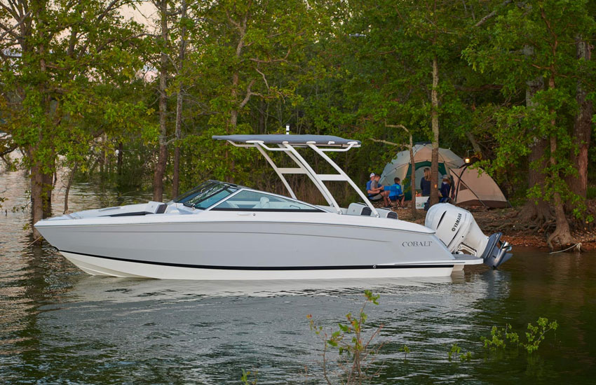 Cobalt R6 Outboard with its outboard motor tilted up.