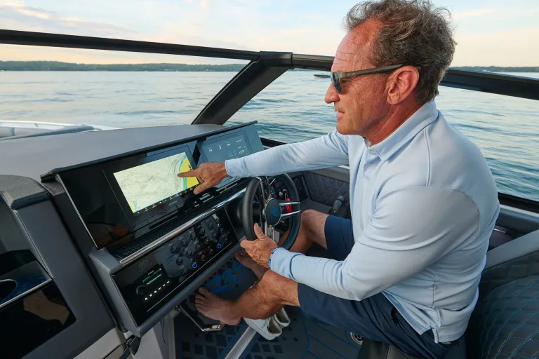 a man driving a boat