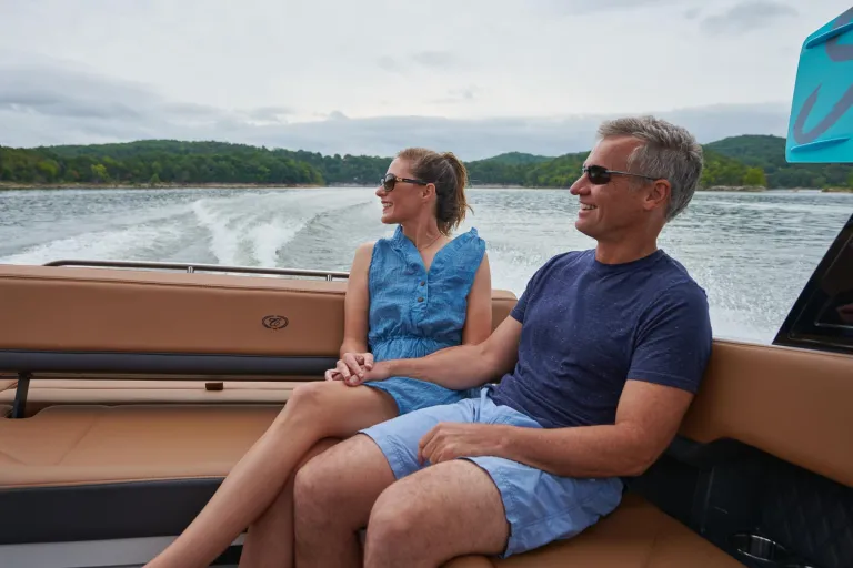 people relaxing in boat