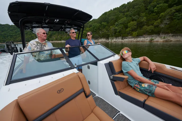 people relaxing in boat