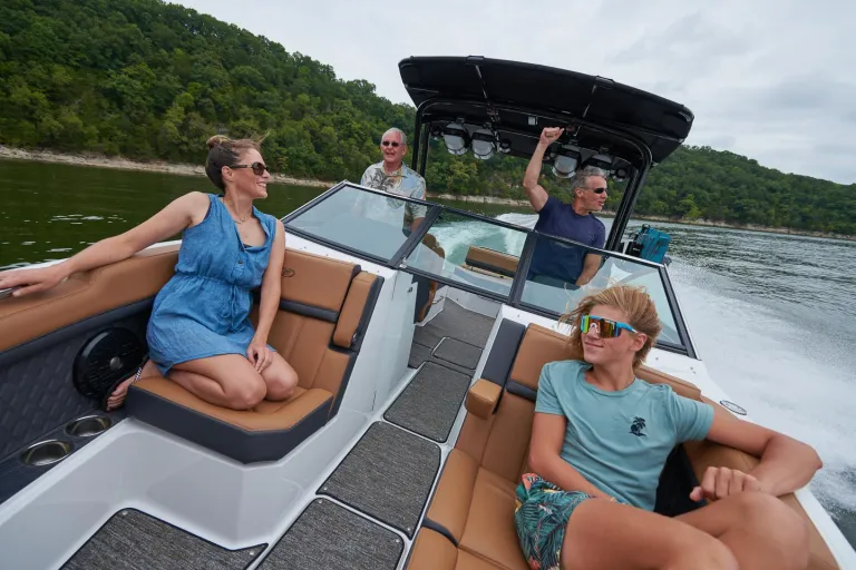 people relaxing in boat