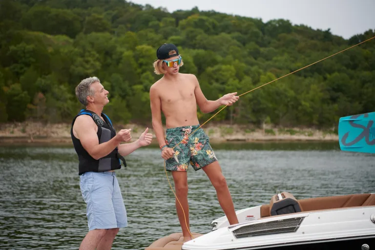 2 people about to go wakesurfing