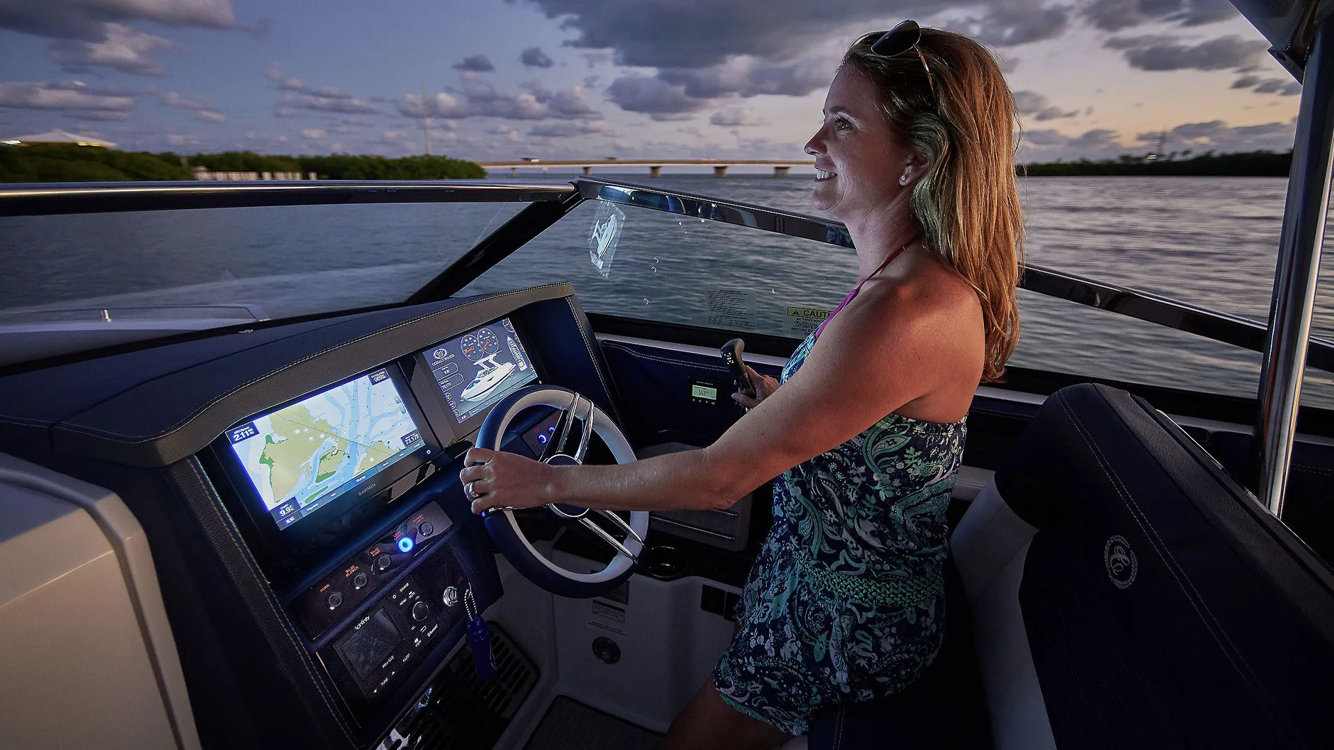 woman steering a boat
