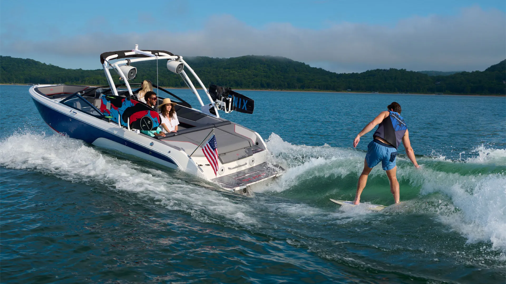 person surfing behind boat