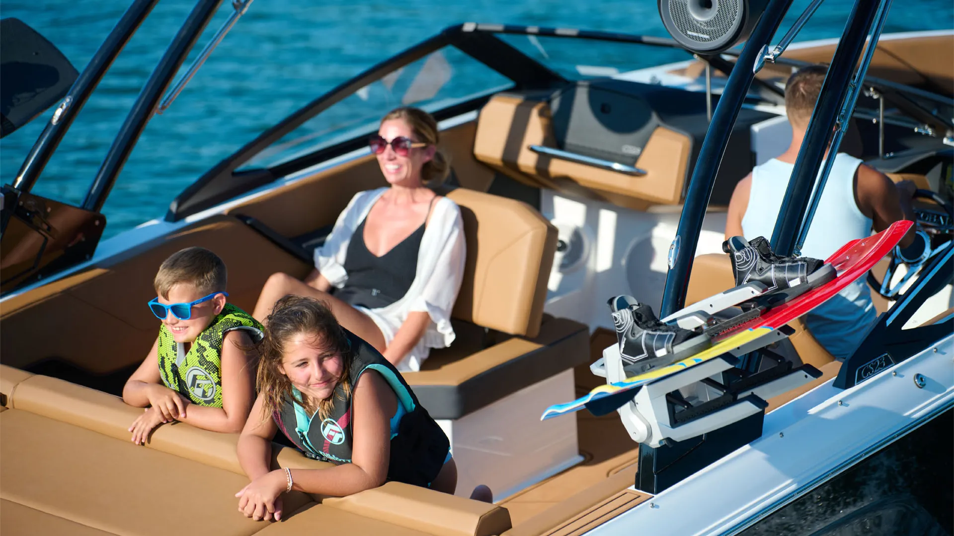 lady and 2 kids on a boat